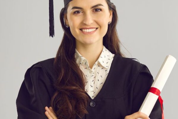 a women holding his degree on his hand